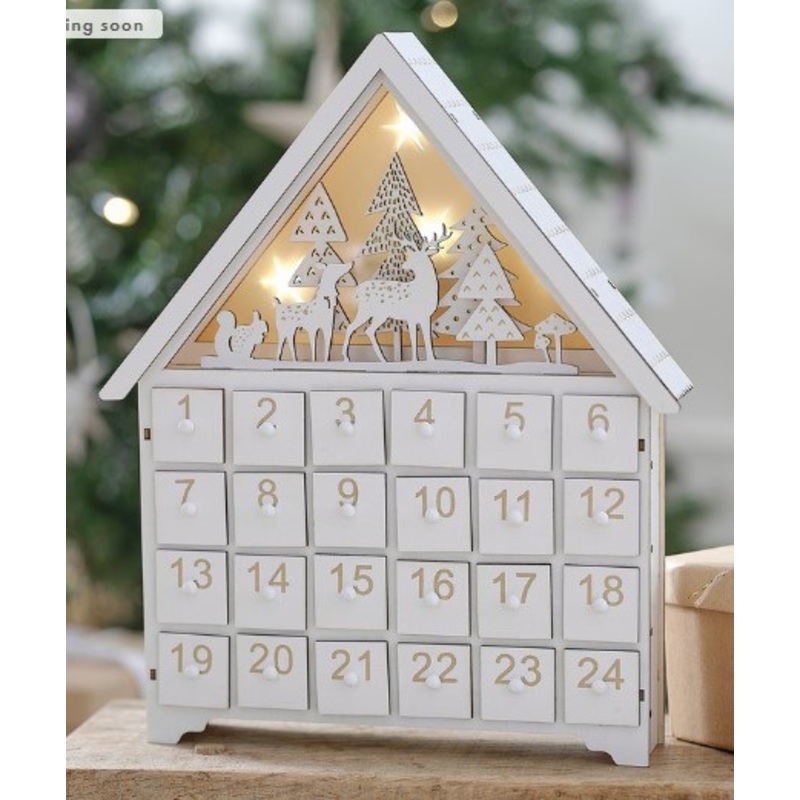 Wooden house advent calendar illuminated